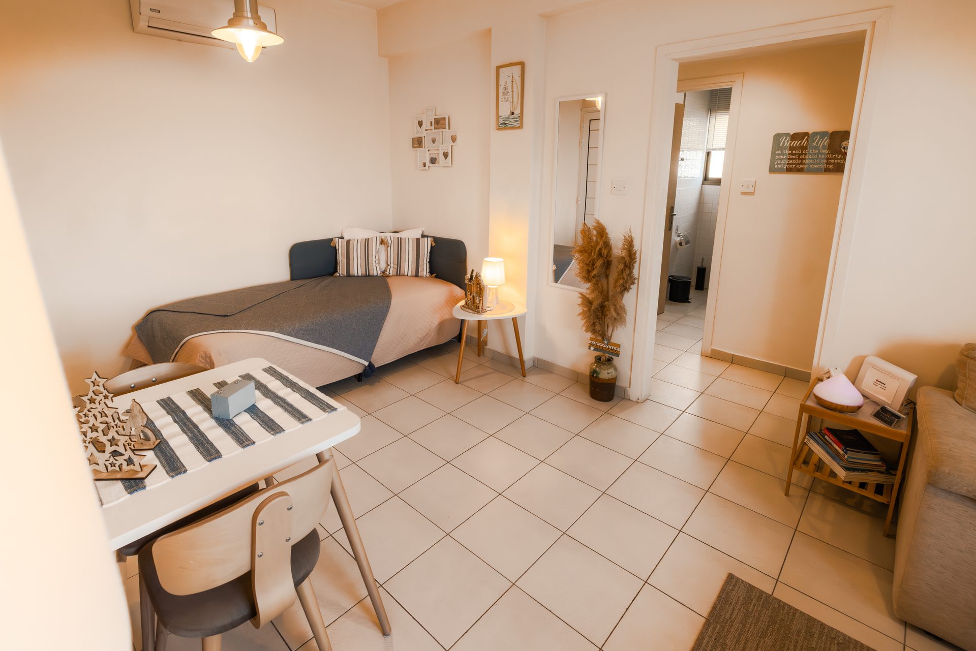 Living area with sofa bed and dining table